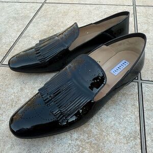Fratelli Rossetti black patent leather loafers with a kiltie fringe detail